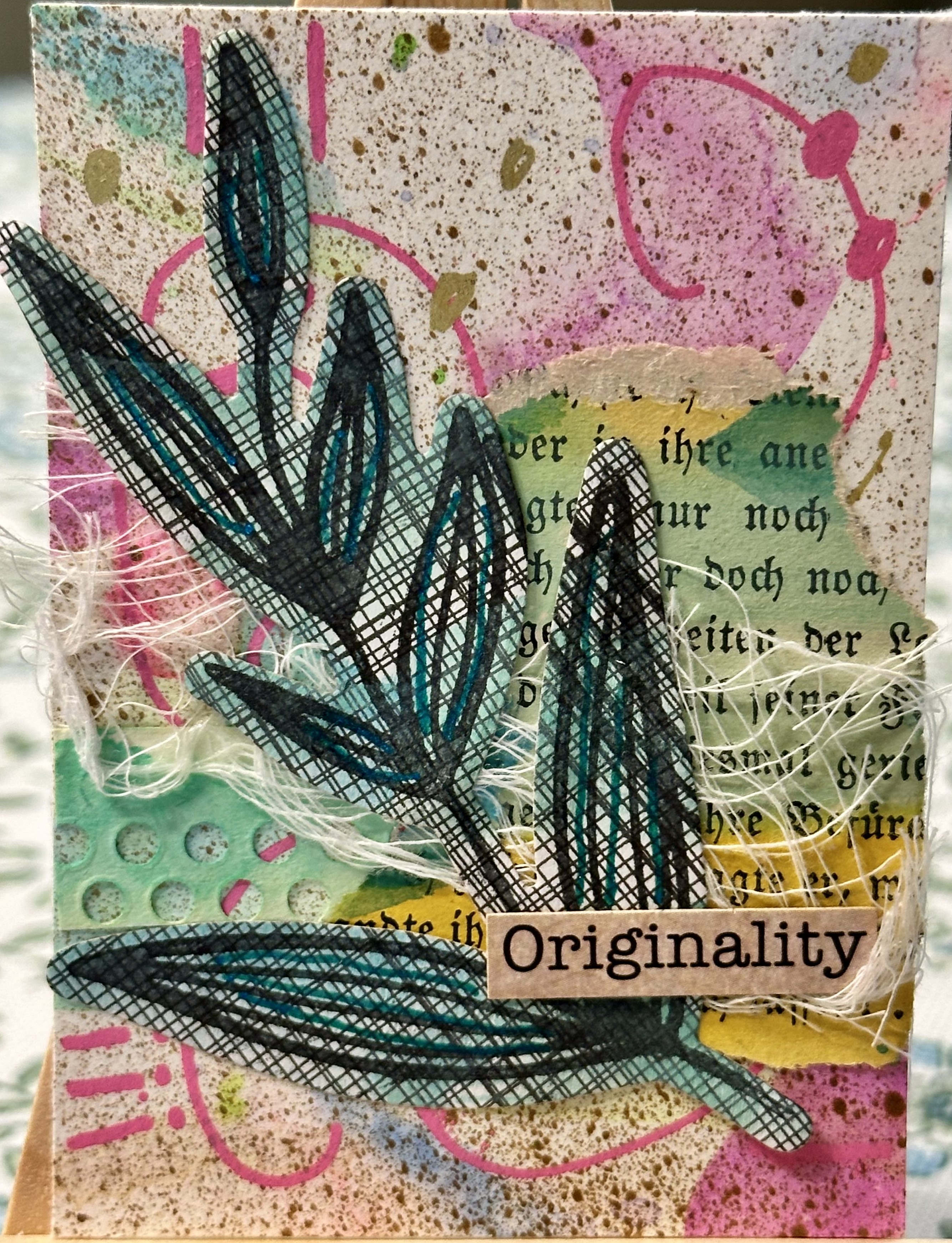 Layered paper collage with thread